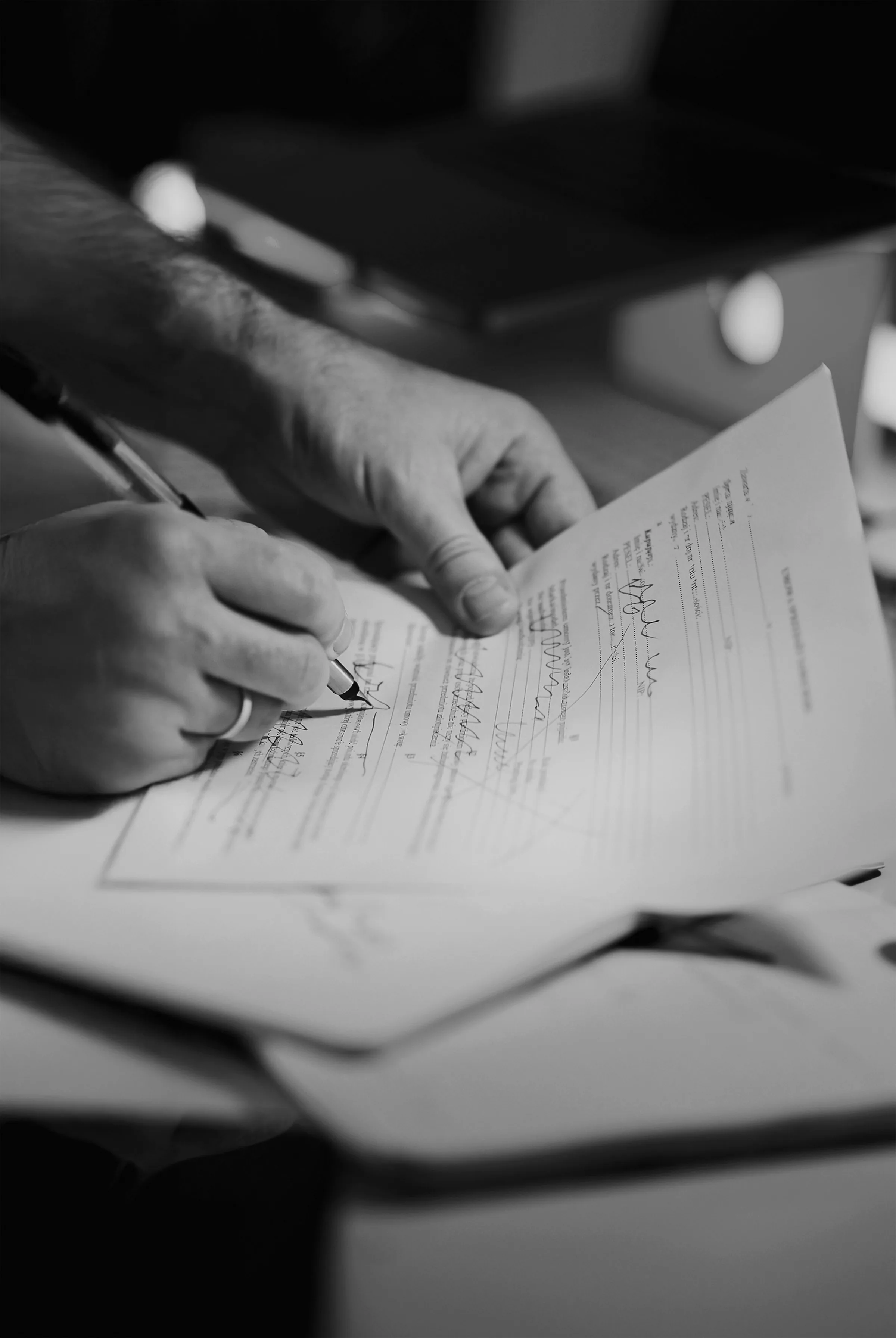 Hand signing manifest, editorial b&w