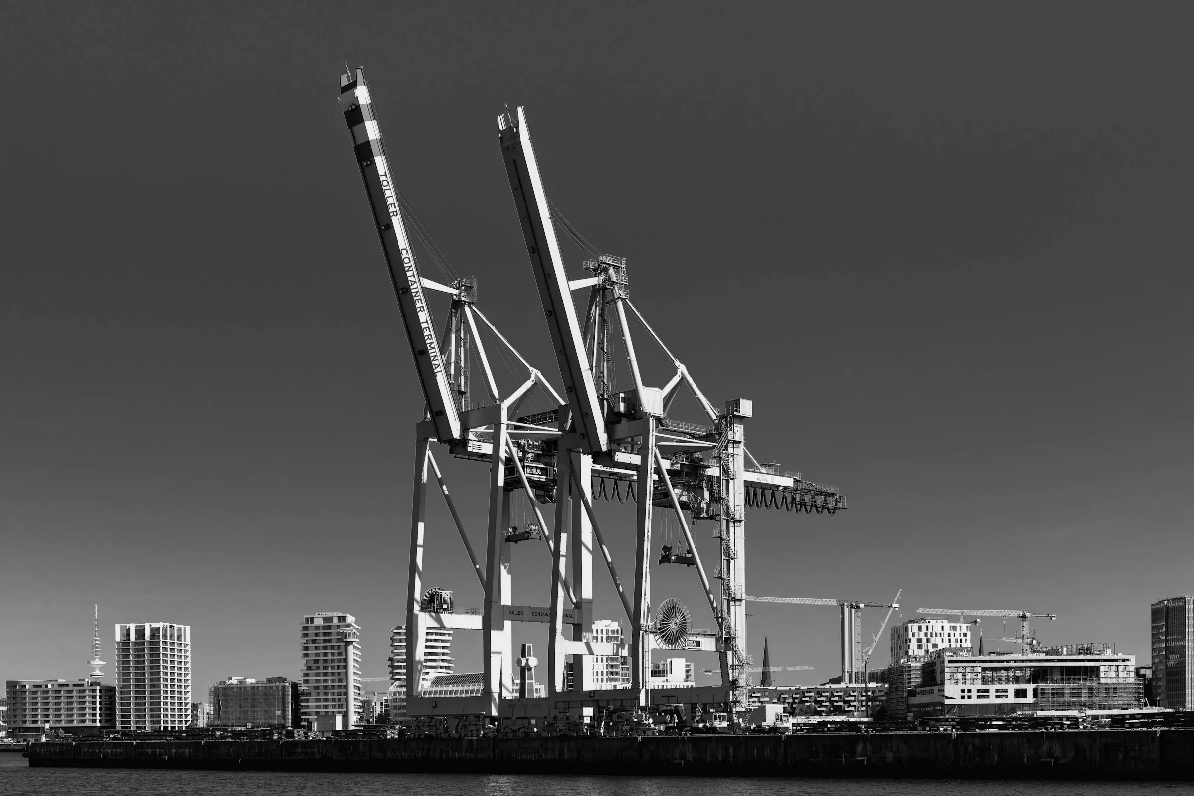 Container port at twilight, editorial b&w